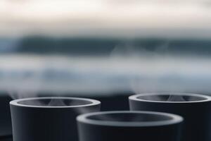 Enjoying warm coffee by the ocean breeze photo