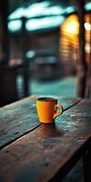 Cozy coffee moment in a rustic setting at dusk photo