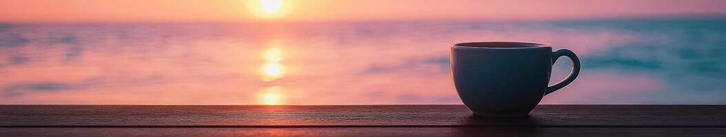 Enjoying coffee at sunrise by the ocean shore photo