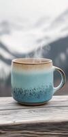 Warm coffee cup on wooden table photo