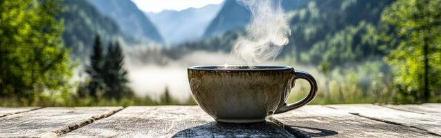 Steaming coffee on wooden table photo