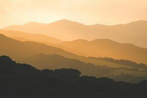 A mountain range with trees and hills photo