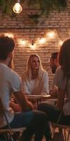 A group of people sitting around a table in a restaurant photo