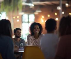 A group of people sitting around a table in a restaurant photo