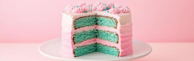 A slice of cake with pink and blue frosting photo
