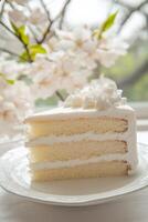 Bento cake slice with cream and floral backdrop photo