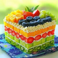 Colorful layered bento cake with fresh fruits photo