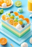 Colorful bento cake with fruity toppings on a blue background photo