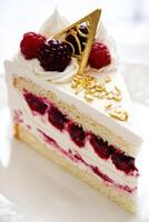 Delicious bento cake with raspberry filling and cream photo