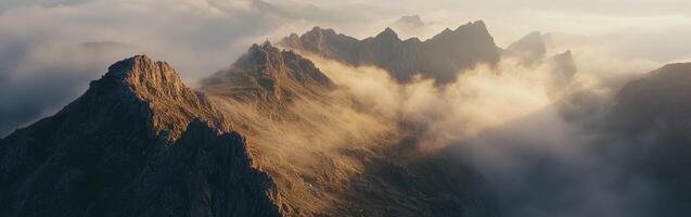 A mountain range is covered in clouds photo