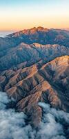 Sunrise over rugged mountains photo