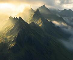 A mountain range with clouds and sun shining through photo