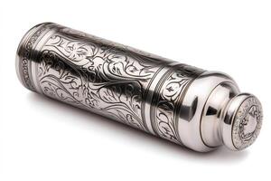 Elegant metallic container lying on white background with floral engravings photo