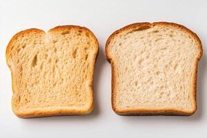 Two slices of bread showing different textures and colors on white background photo