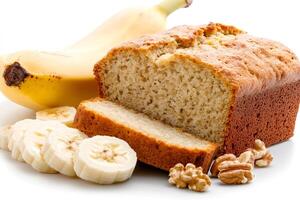 Homemade banana bread loaf with walnuts and sliced bananas photo