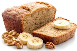Homemade banana bread loaf with walnuts, pecans and banana slices on white background photo