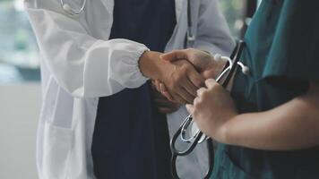 A doctor shaking hands with another doctor video