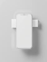 An iphone is sitting on a white surface photo
