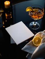 A notepad, napkin and a glass of wine on a table photo