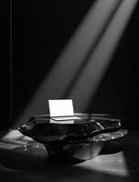 A black and white photo of a laptop on a table