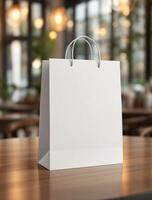 White paper shopping bag mockup on wooden table in cafe photo
