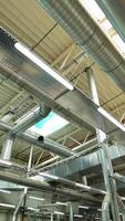View of the ventilation system of the parquet factory. Camera motion to forward Vertical video