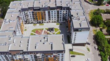Modern building of residential complex. Aerial drone view over apartment blocks in city video