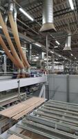 modern process of working of floorboard on an automated line. A waste avoidance. Vertical video