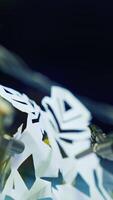Metal cyborg preparing snowflake from paper while preparing to the Christmas. Cropped view. Robotic industry concept. Vertical video