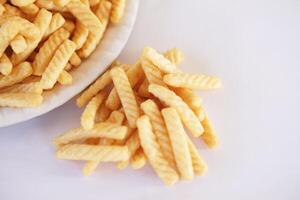 Prawn cracker sticks, Shrimp crisp rice snack on white background. Concept, traditional crunchy food snack appetizer. photo