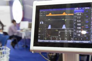 Close-up of a heart rate monitor displaying vital signs in a modern hospital setting photo