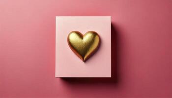 Golden heart on pink background photo