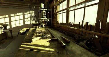 Sunlight filters through windows in a woodworking shop filled with tools video