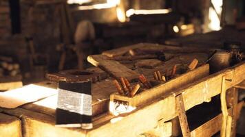 Woodworking tools arranged on a workshop table in warm afternoon light video