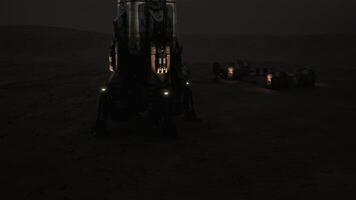 Mars colony lit at night, highlighting advanced tech and habitat video