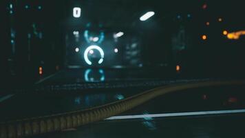 A close view of a laboratory floor with glowing equipment and reflection video
