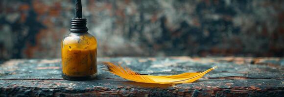 A bottle of oil and a feather on a wooden table photo