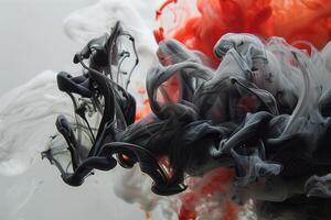A close up of red and black ink in water photo