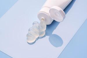 Gel toothpaste in a tube on a blue background. photo