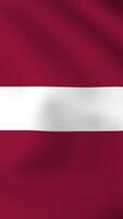 Vertical, portrait waving national flag of Latvia. Smooth animation with highly detailed, realistic animated background for social media, screens smartphone. Cloth motion, official colors. video