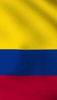 Vertical, portrait, waving national flag of Colombia. Smooth animation with highly detailed, realistic animated background for social media, screens smartphone. Cloth motion, official colors. video