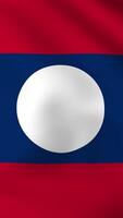 Vertical, portrait waving national flag of Laos. Smooth animation with highly detailed, realistic animated background for social media, screens smartphone. Cloth motion, official colors. video