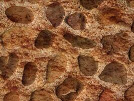 A brown and red stone surface with many different shapes video