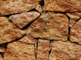 A close up of a stone wall with many different types of rocks video