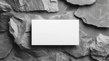 Top view template for business card. Mockup white card on grey slate texture background. photo