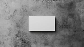 Top view template for business card. Mockup white card on texture background in grey colors. photo