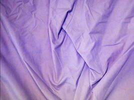 A purple sheet of fabric with a cat on it video