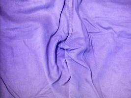 A close up of a purple cloth with a zipper video