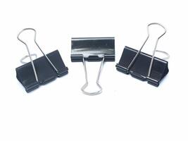 collection of large black paper clips isolated on white background photo