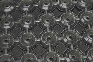 circular pattern of isolated plastic, placed on a black surface. photo